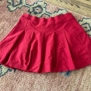 Red pleated mini-skirt, size S, USC colors